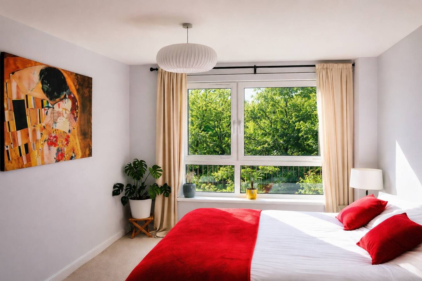The main bedroom: a super-king bed and a wall of morning light