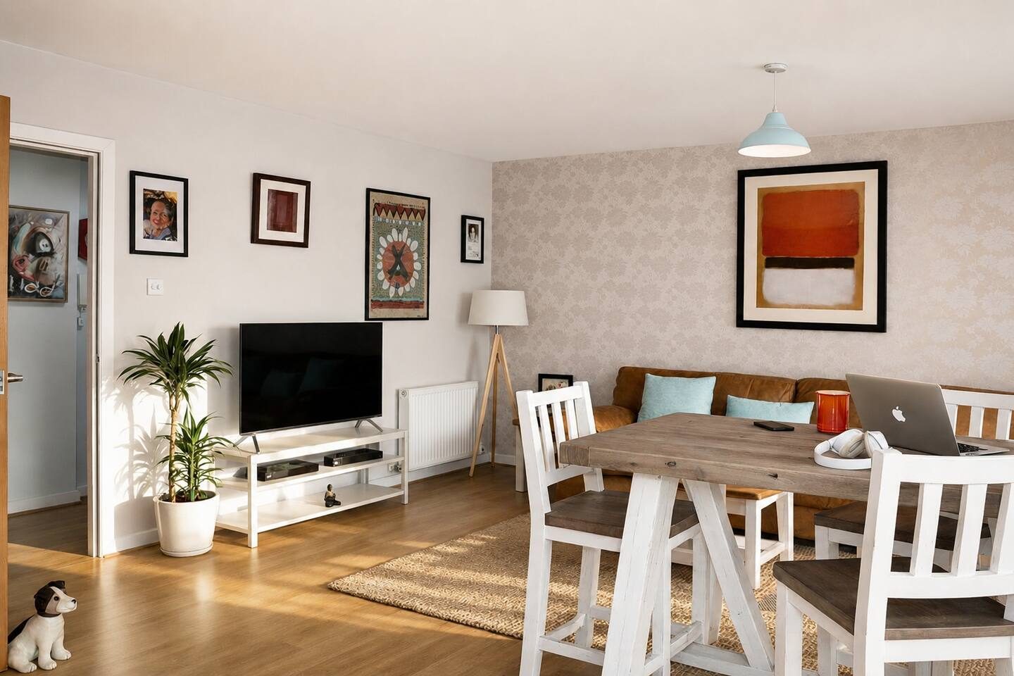 The dining area and living room, with a 50-inch smart TV