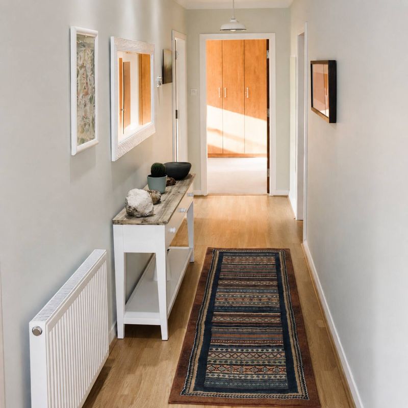 The hallway, hung with art the length of the flat